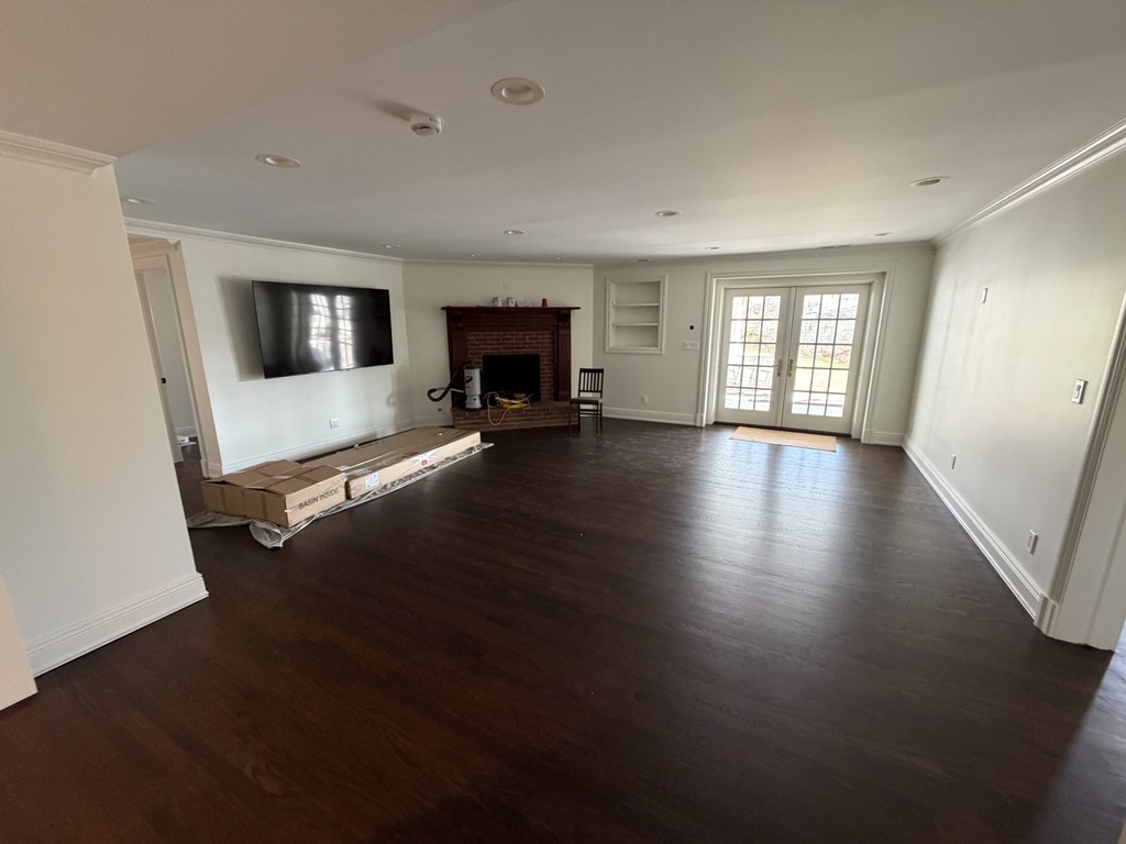 Basement Finish — Hardwood, Crown Molding & Tray Ceiling — completed by FirstLine Build Group in Poughquag, NY